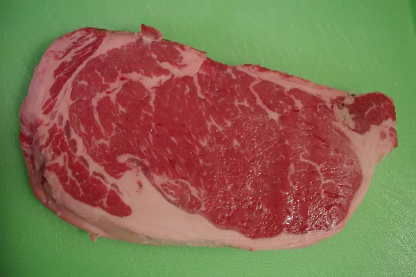 A raw beef steak, close up