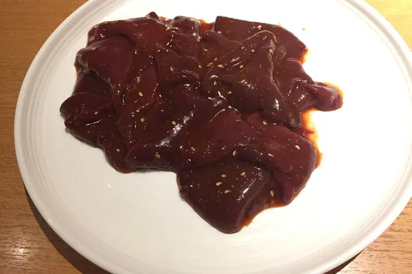 Raw beef liver on a plate