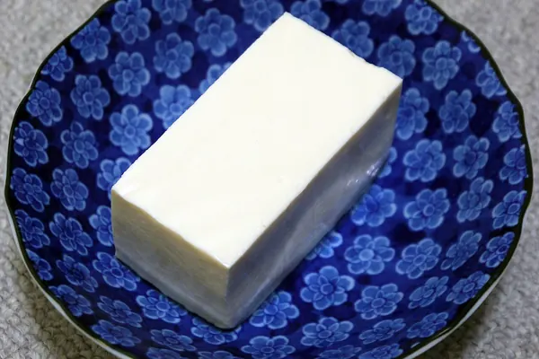 Block of silken tofu on a plate