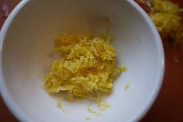 Grated lemon zest in a bowl