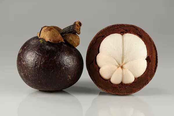 Mangosteen fruits, whole and opened