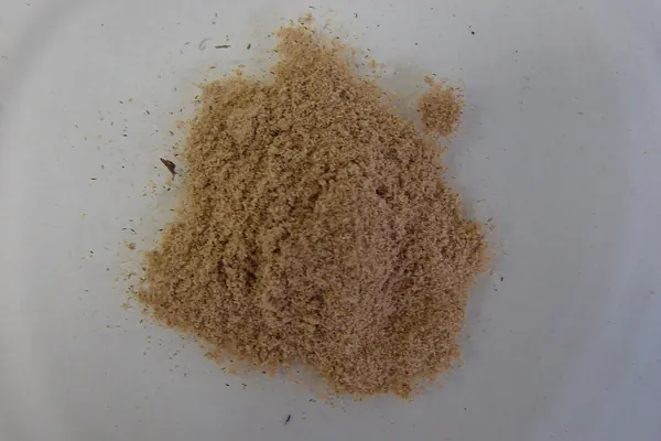 Powdered muira puama wood (Ptychopetalum olacoides) on a light background