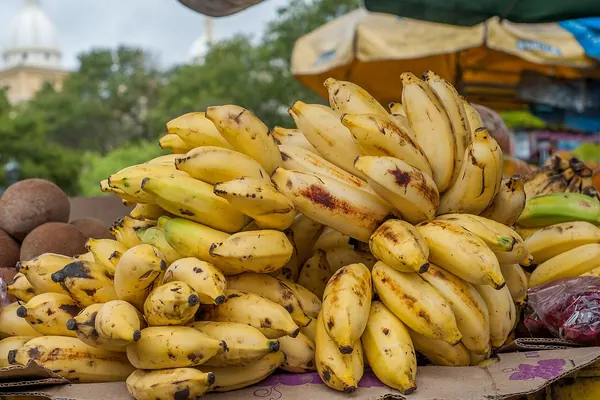 Bunches of bananas at a market, a common food source of potassium
