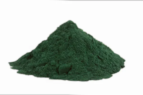 A pile of dark green spirulina powder