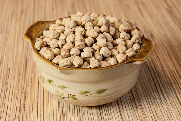 Chickpeas in a ceramic bowl, a common food source of vitamin B6