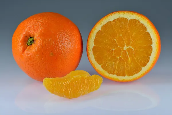 Oranges, whole, halved and in segments